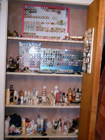 top shelf- lesser used shadows and lippies<br />second shelf- brushes and foundation on the left, blushes on board #1, SN shadows on blue boards with DM shadows along the bottom, lippies lined up on shelf<br />third shelf-skincare galore!!! I promise it's organized a certain way but will not delve into it. Plumpers, bath, and fragrance down here too<br />fourth shelf-first aid, nailpolish, and haircare<br />floor space- random storage<br />closet door- foundation, concealer, and finisher board